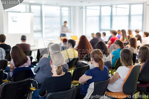 Image of Speaker giving presentation on business conference.