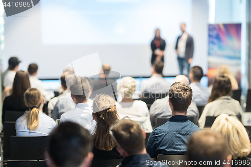 Image of Business speakers giving a talk at business conference event.