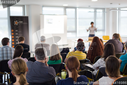 Image of Speaker giving presentation on business conference.