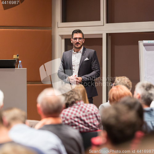 Image of Business speaker giving a talk at conference meeting.