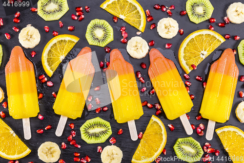 Image of Fruit popsicles ice cream on black