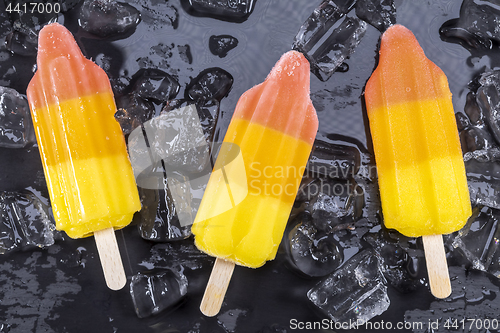 Image of Fruit popsicles ice cream on black