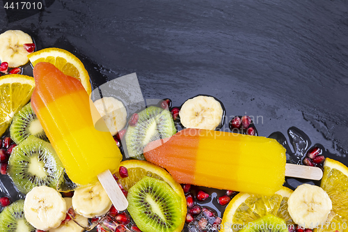 Image of Fruit ice cream on stick with slices fruits 