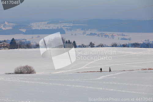 Image of unidentified skier on the horizon winter landscape