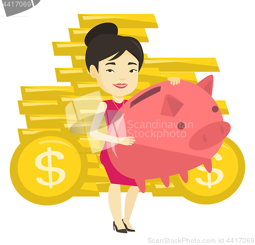 Image of Business woman holding big piggy bank.