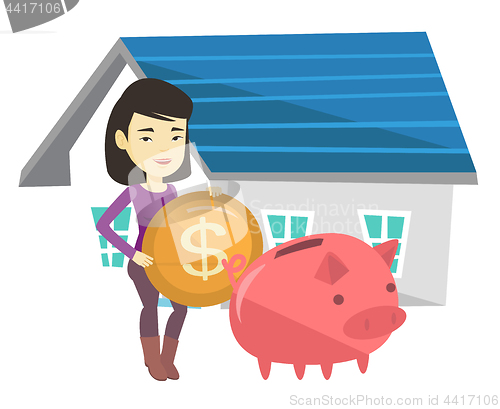 Image of Woman puts money into piggy bank for buying house.