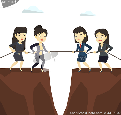 Image of Two groups of business people pulling rope.