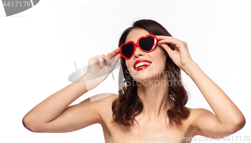 Image of woman with red lipstick and heart shaped shades