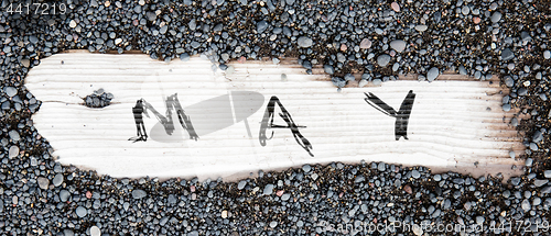 Image of Sand on planked wood - May