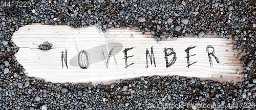 Image of Sand on planked wood - November