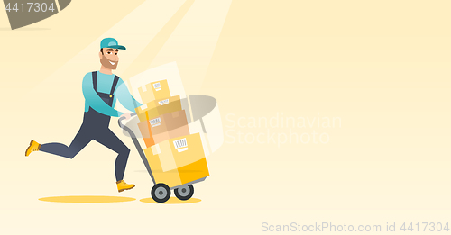 Image of Delivery postman with cardboard boxes on trolley.