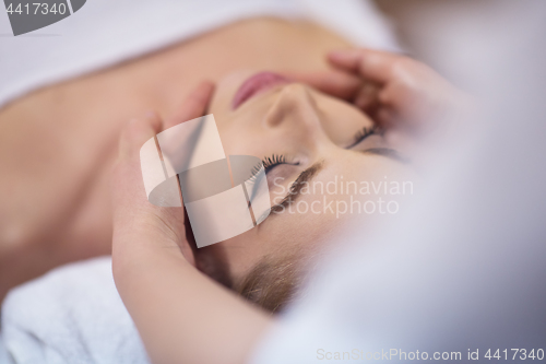 Image of woman receiving a head massage