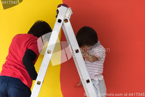 Image of boys painting wall