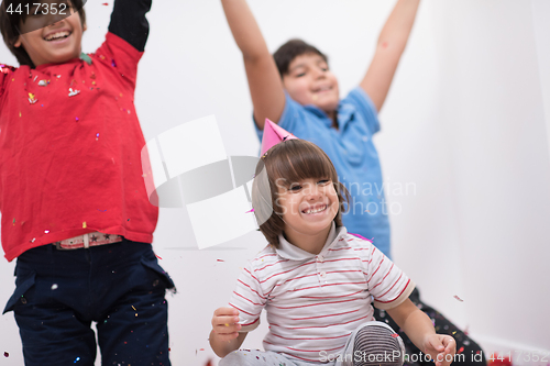 Image of kids  blowing confetti