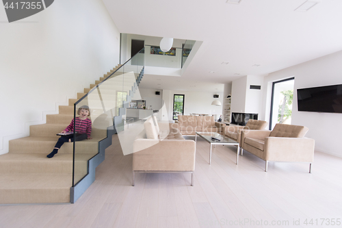 Image of little cute girl enjoying on the stairs