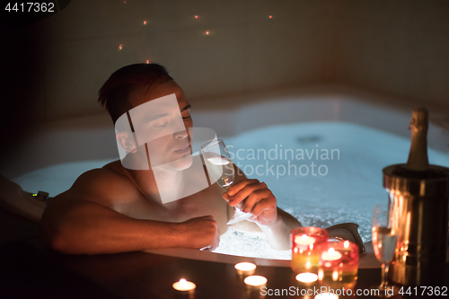 Image of man relaxing in the jacuzzi