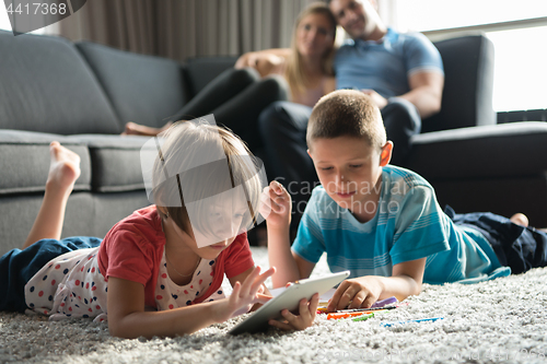 Image of young couple spending time with kids