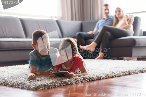 Image of couple spending time with kids