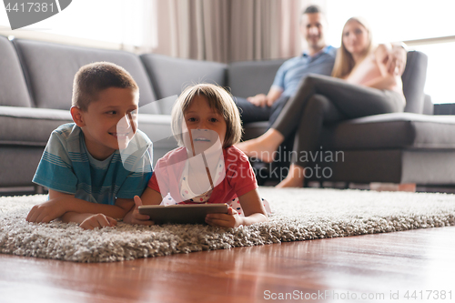 Image of couple spending time with kids