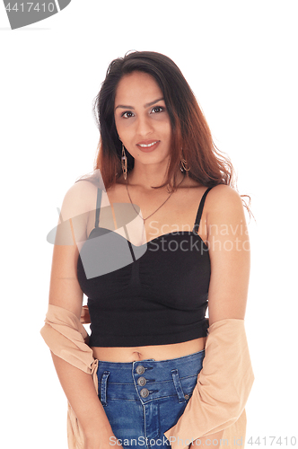 Image of Lovely woman in a corset and jeans smiling