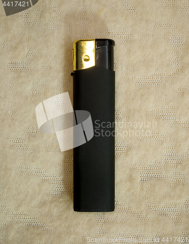 Image of gas lighter of black color