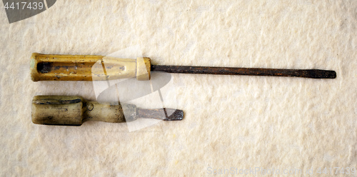 Image of two old rusty screwdrivers