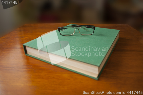 Image of lying book with a green cover