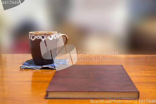 Image of book and cup