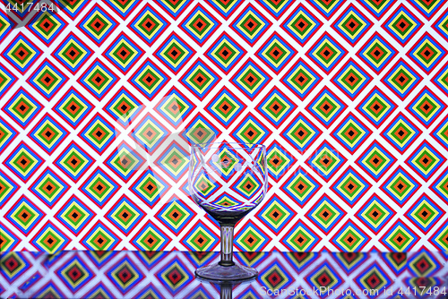 Image of Glass wine glass on a background of squares