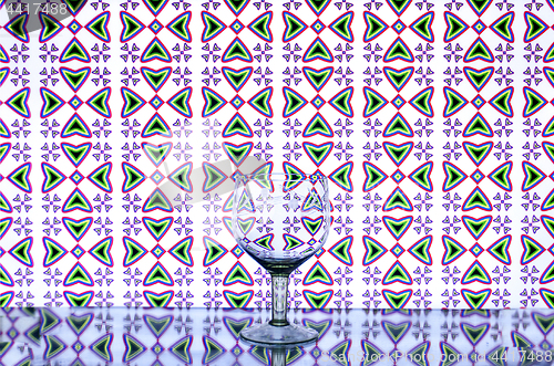 Image of glass wine glass on the background of crosses