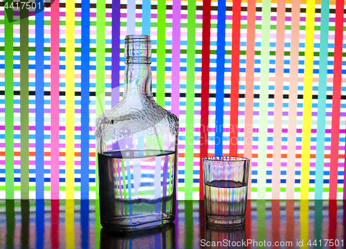 Image of Glass bottle of vodka and glasses