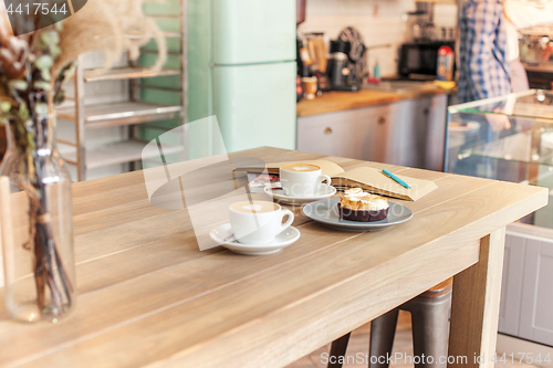 Image of A table setting for coffee on the counter at a coffee house