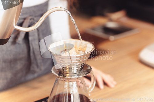 Image of Barista, cafe, making coffee, preparation and service concept