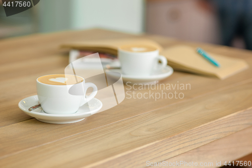 Image of A table setting for coffee on the counter at a coffee house