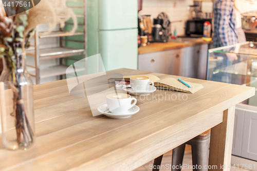 Image of A table setting for coffee on the counter at a coffee house