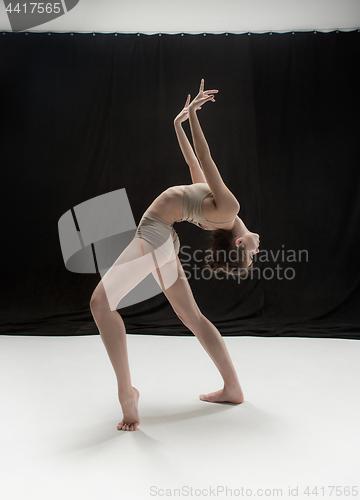 Image of Young teen dancer on white floor background.