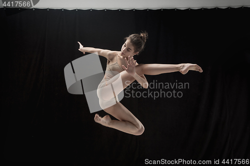 Image of Young teen dancer on white floor background.