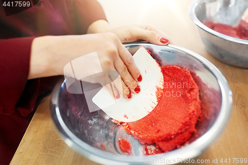 Image of chef making macaron batter at confectionery