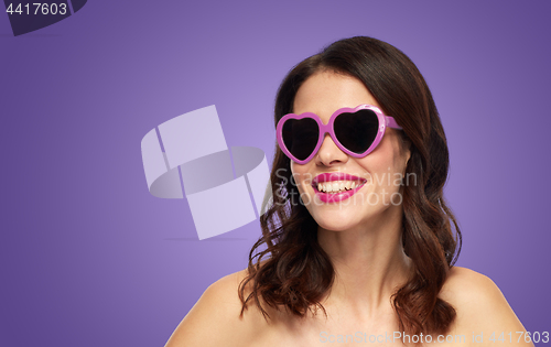 Image of woman with heart shaped shades over ultra violet