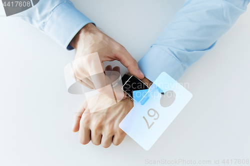 Image of hands with smart watch and social media icons