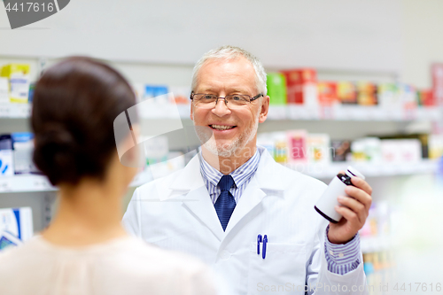 Image of apothecary and woman with drug at pharmacy