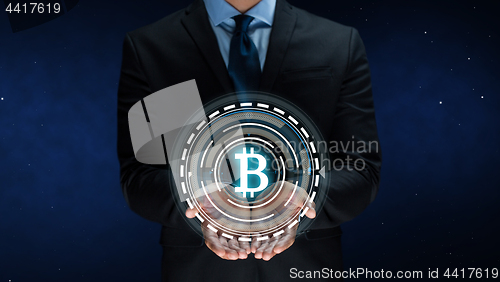 Image of close up of businessman with bitcoin hologram