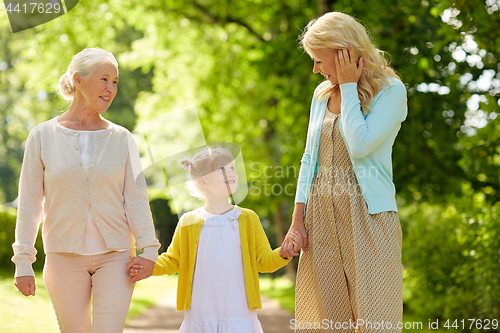 Image of woman with daughter and senior mother at park