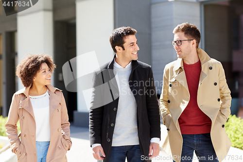 Image of office workers or friends talking on city street