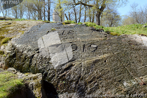 Image of War memorial carved into rock on Suomenlinna island