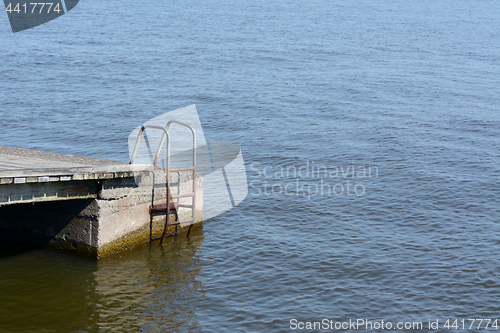 Image of Rusted metal ladder on the side of a jetty