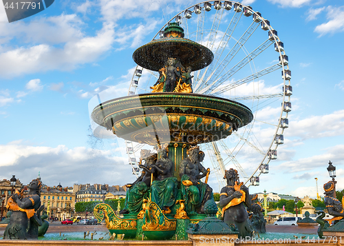 Image of Fountain and ferris wheel in Paris