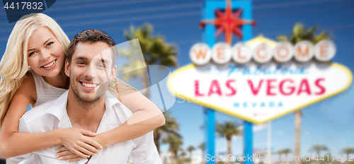 Image of couple in shades over las vegas sign at summer