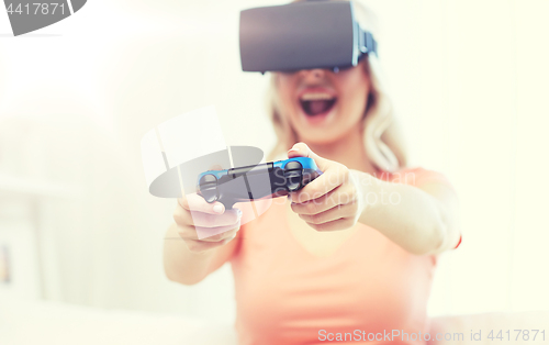 Image of woman in virtual reality headset with controller