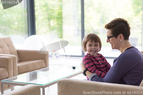 Image of mother and cute little girl enjoying their free time